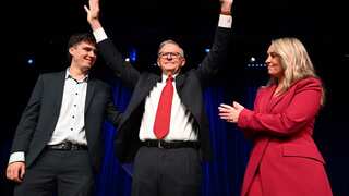 Australian Prime Minister Anthony Albanese, Partner Jodie Haydon and son Nathan acknowledge the crowd at the Labor Election Night function (AAP).
