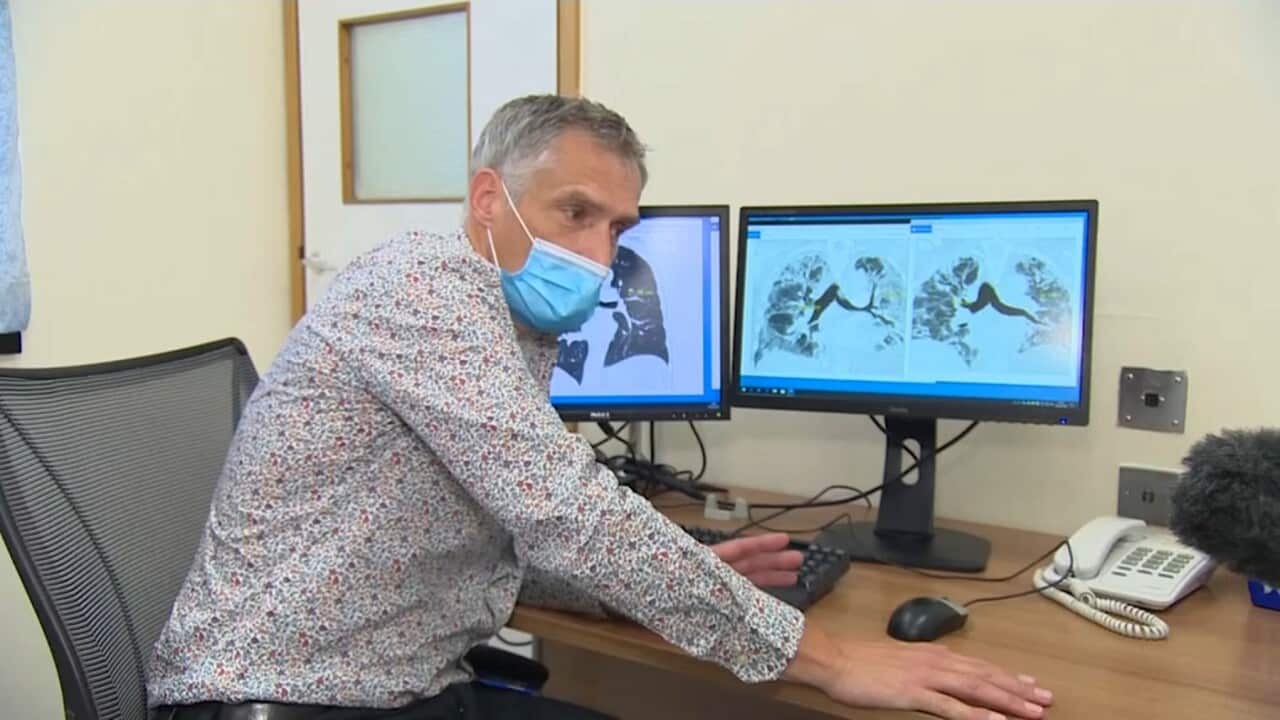 Professor Gisli Jenkins examining scans of the lungs