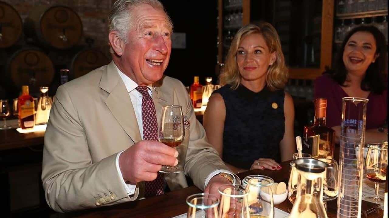 Prince Charles tasting a sample of Bundaberg Rum