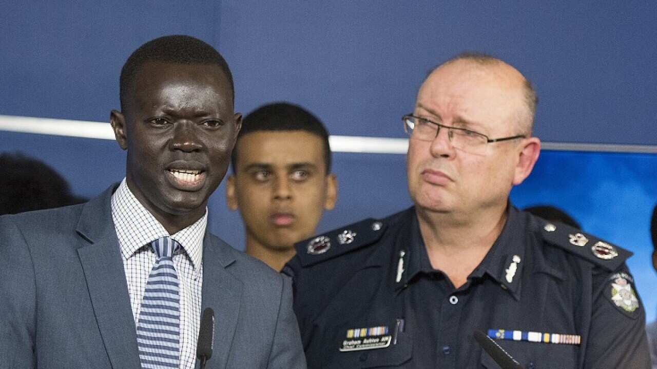African community member Kot Monoah and Graham Ashton speak to media about the taskforce on Wednesday.