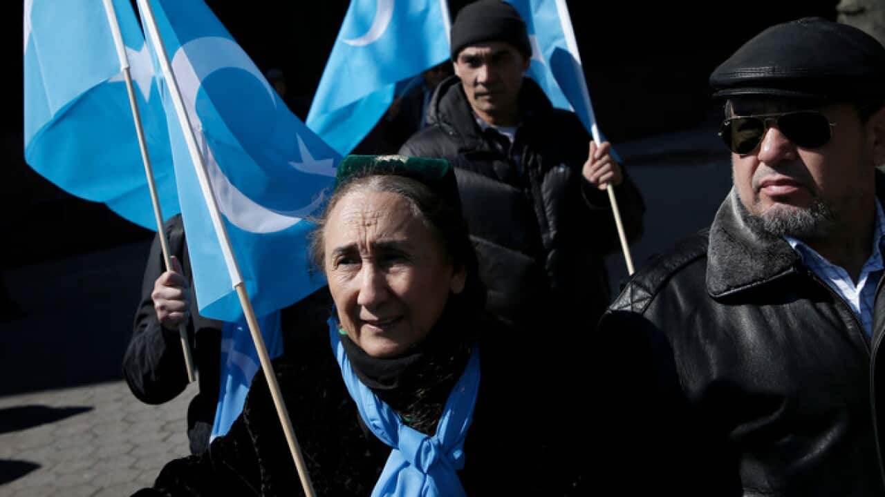 Uighurs and their supporters rally outisde the United Nations headquarters in New York in 2018