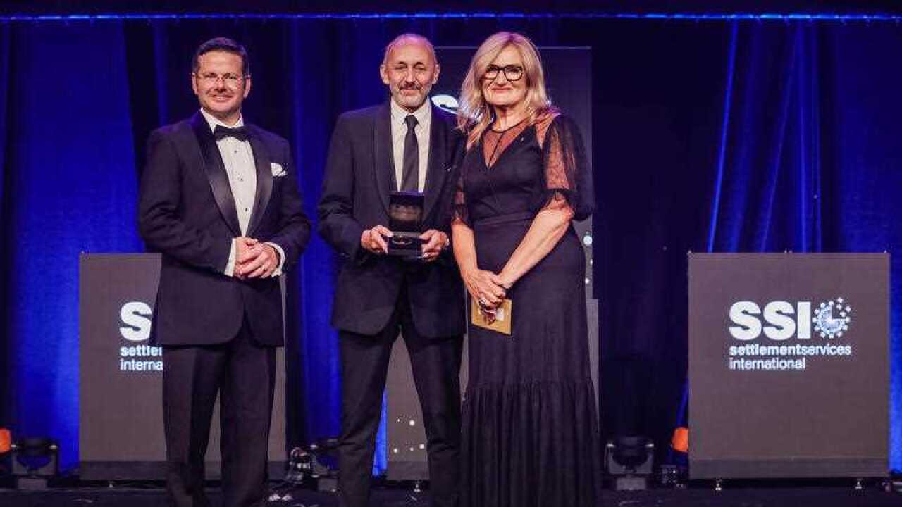 Ravi Prasad (centre) being presented a medal by NSW Minister for Multiculturalism Mark Coure (L) and SSI CEO Violet Roumeliotis (R) Premier's Harmony Dinner.