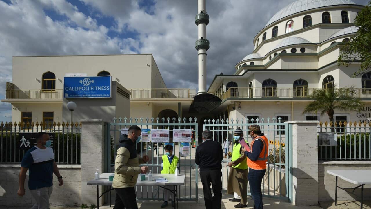 Members of the muslim community celebrate the Islamic holiday of Eid al-Adha at the Auburn Gallipoli Mosque in Sydney, Friday, July 31, 2020.  