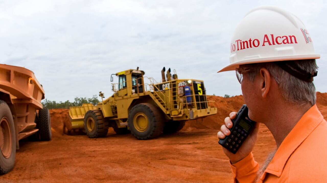 Workers overseeing a loader, Queensland's western Cape York Peninsula