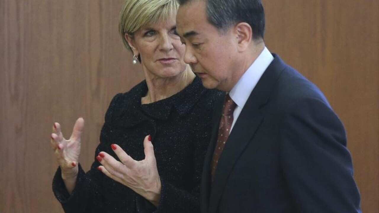 A file image of Julie Bishop with Chinese Foreign Minister Wang Yi.