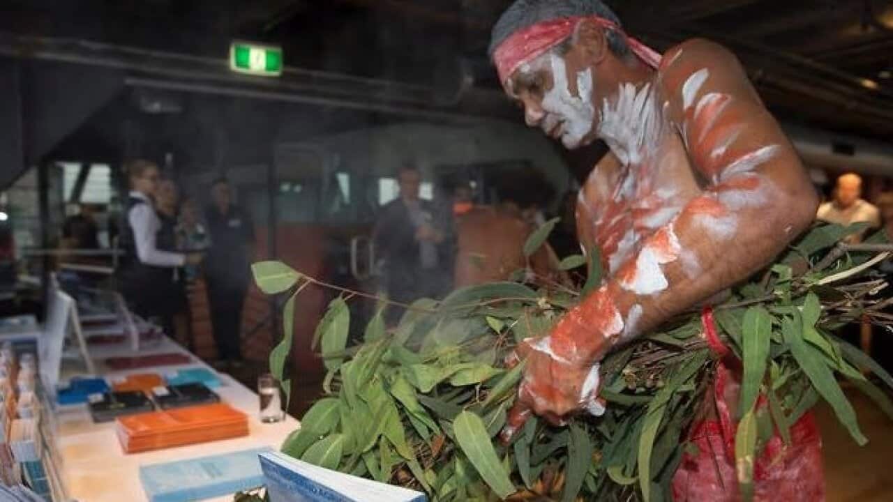 A smoking ceremony takes place at Bangarra Dance Theatre, Sydney, during the launch of the prostate awareness.