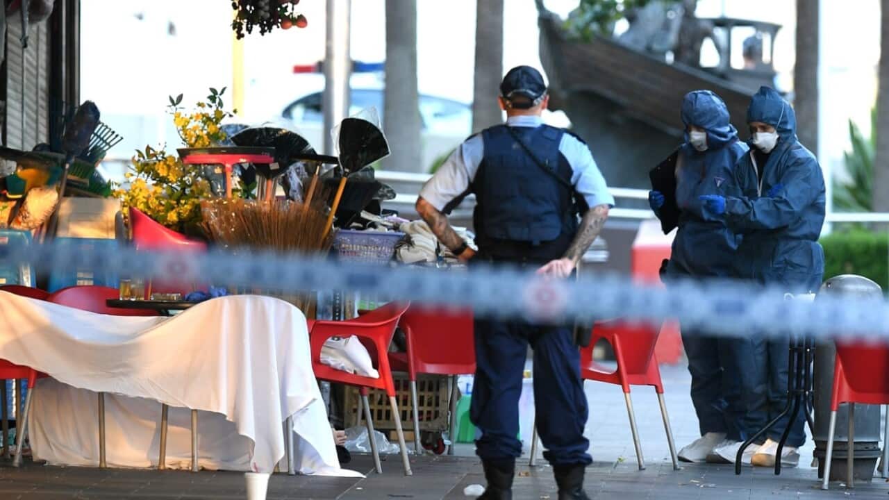 NSW Police and Forensic Services officers attend the scene of a shooting at a cafe at Bankstown City Plaza, in Bankstown, Tuesday, January 23, 2018.