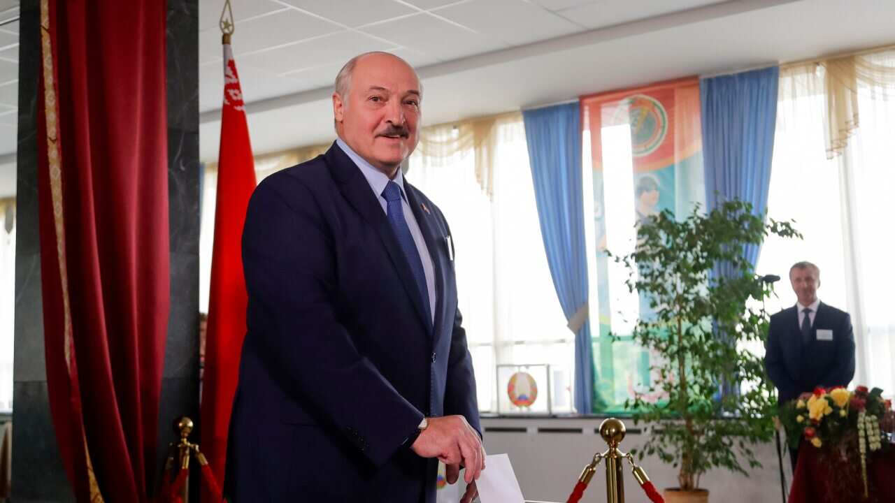 Belarusian President Alexander Lukashenko  casts his ballot at a polling station during the presidential election in Minsk, Belarus, Sunday.