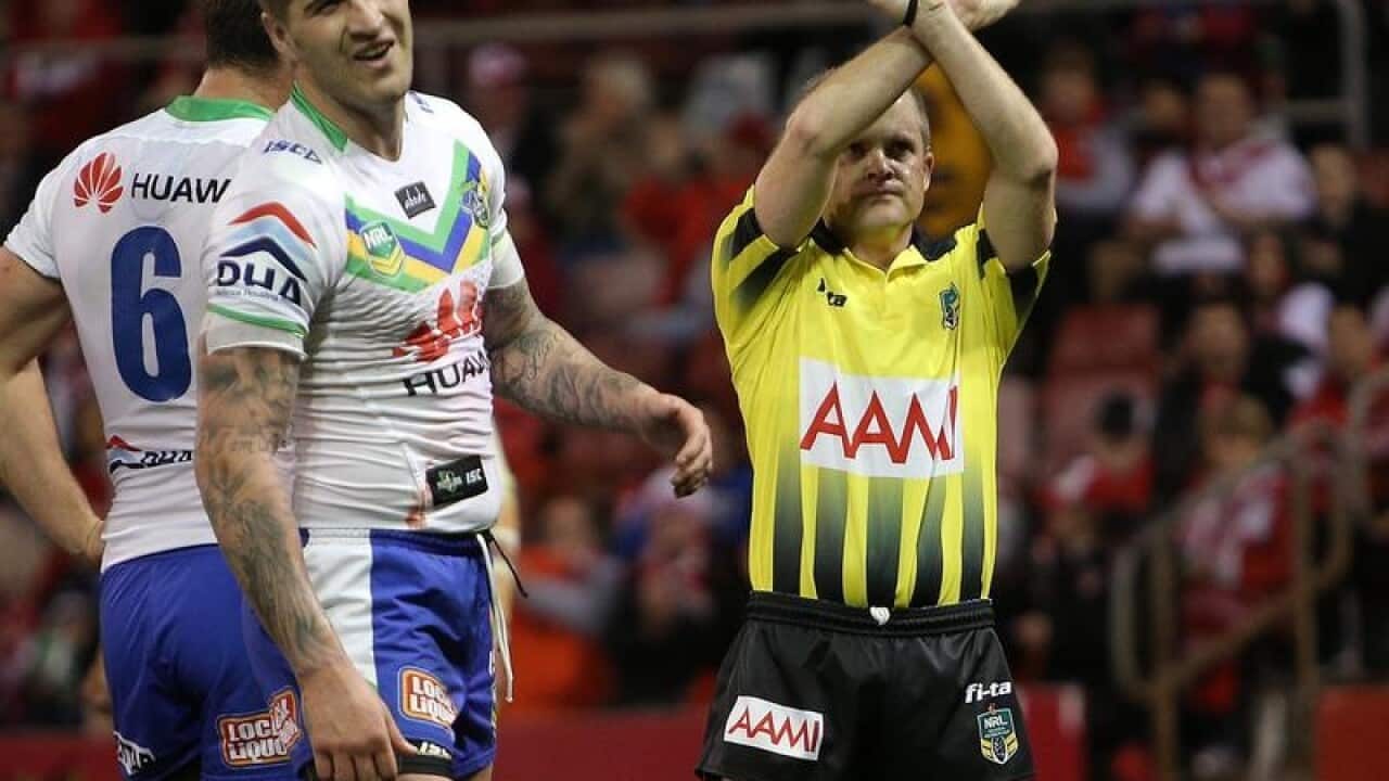 Referee Chris James puts Joel Thompson on report during a game