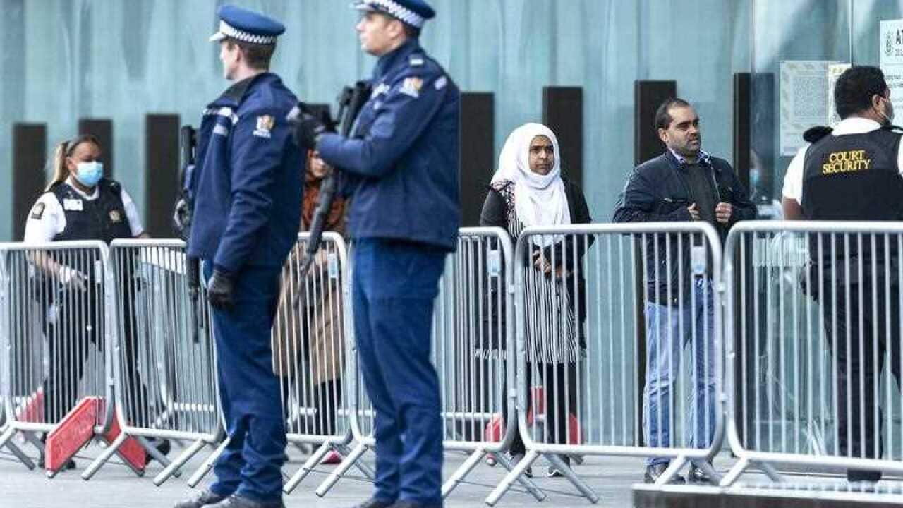 Victims and relatives wait to enter the Christchurch High Court for the final day in the sentencing hearing for the Australian gunman.