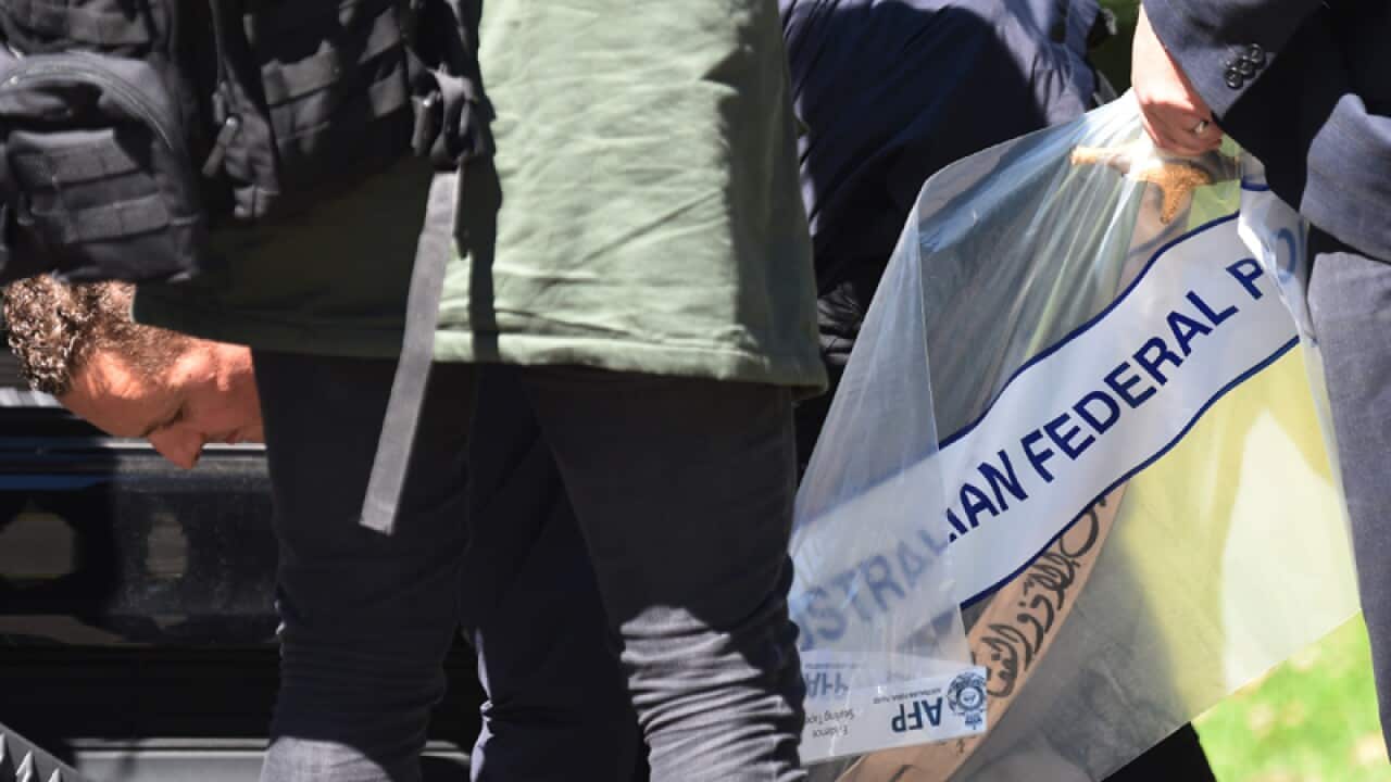 Evidence is seized during a police raid in Sydney