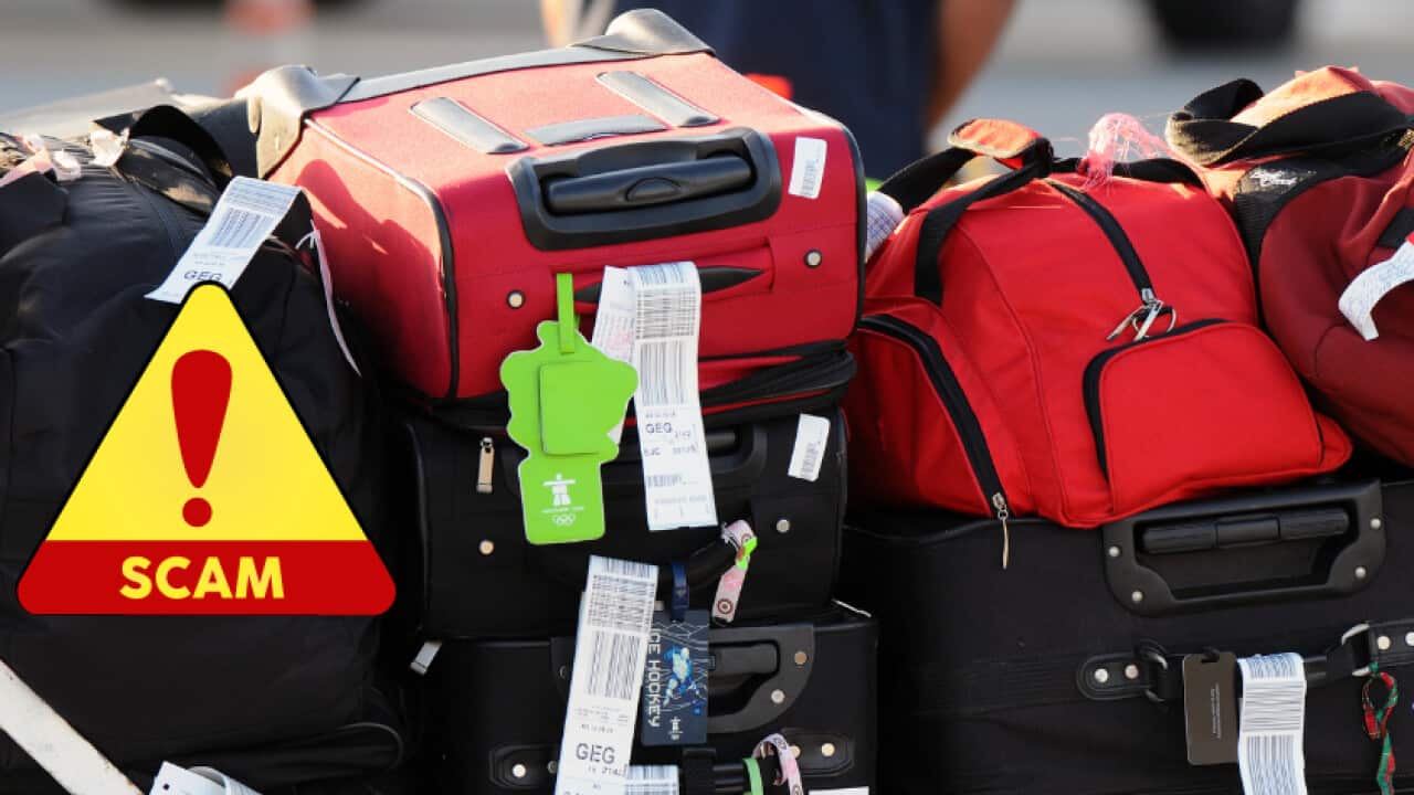 A stack of suitcases labelled with tags.