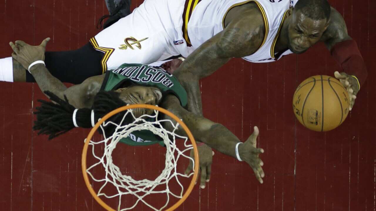 Cleveland' LeBron James, top, against Boston' Jae Crowder