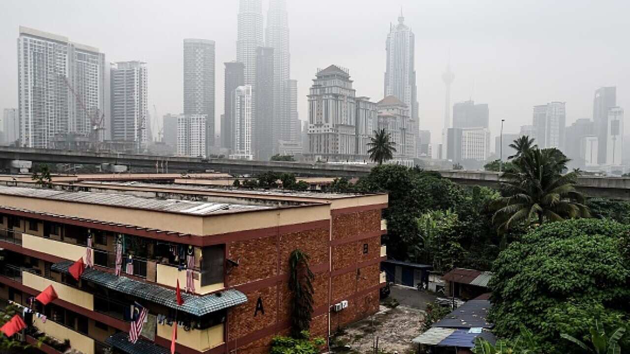 Malaysia's iconic Petronas twin towers and Kuala Lumpur's skyline are shrouded in thick haze. (Getty)
