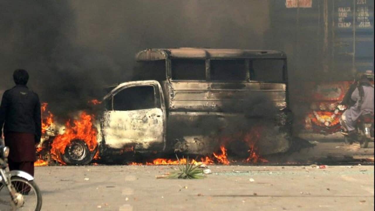Islamist protesters burn a police vehicle in Pakistan's capital.