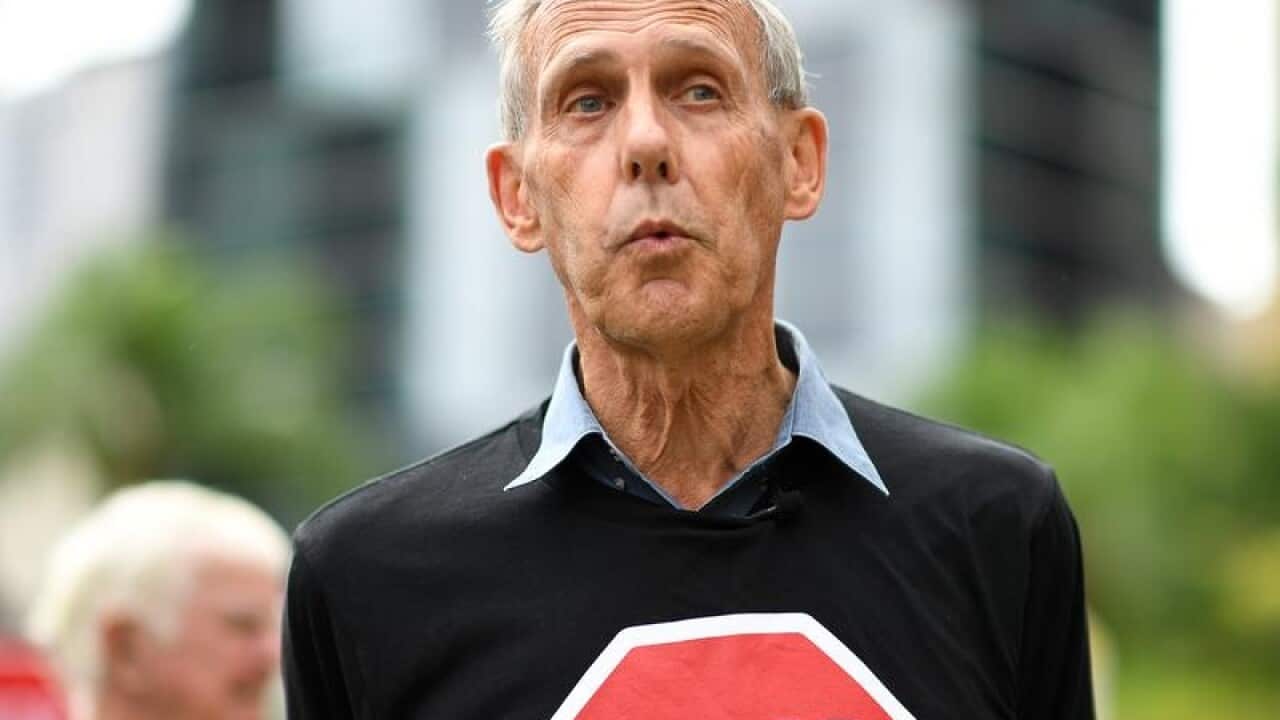 Former Greens leader Bob Brown wearing anti-Adani logo