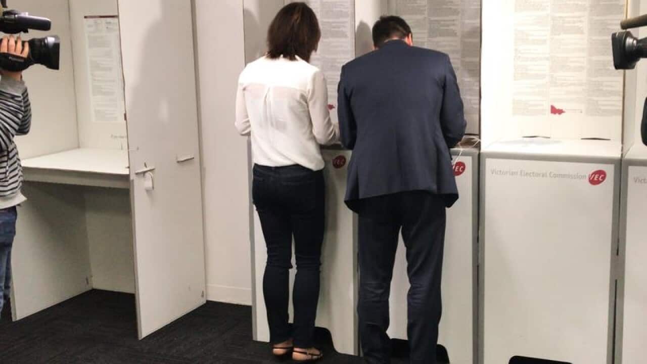 Matthew Guy (right) and his wife Renae vote 2018