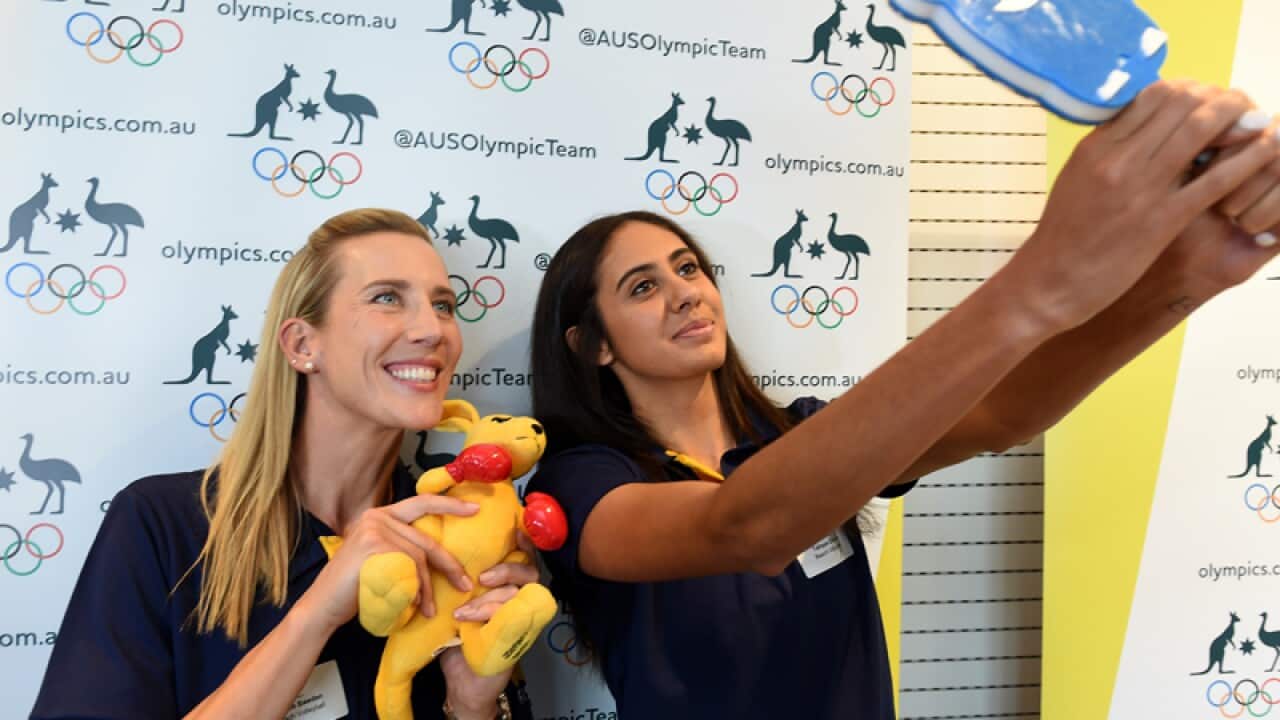 Australian beach volleyballers Louise Bawden (L) and Taliqua Clancy