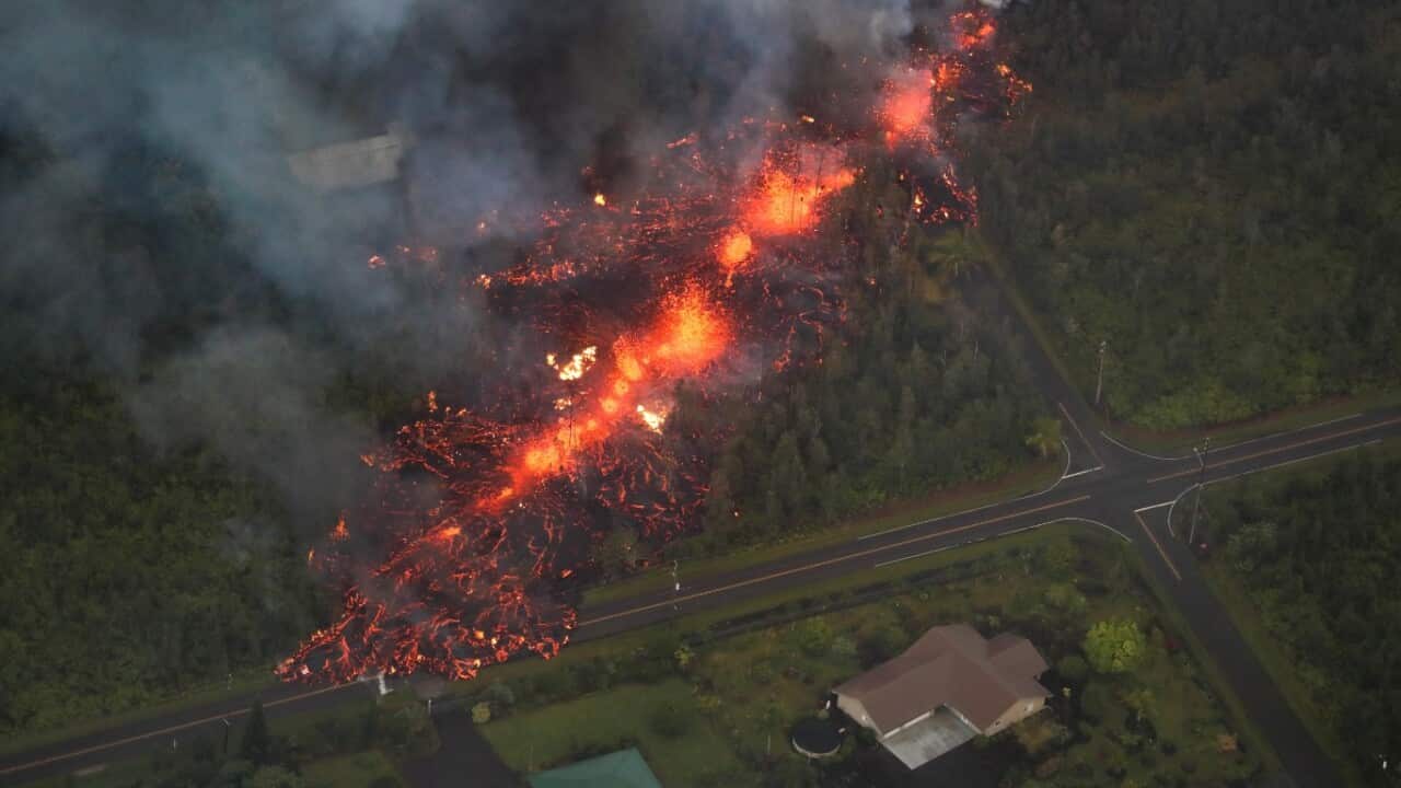 A 2,000 foot long fissure erupts within the Leilani Estates subdivision, on the east rift zone of the Kilauea volcano threatening homes of hundreds