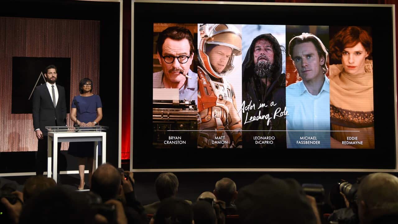 John Krasinski, left, and Academy President Cheryl Boone Isaacs 