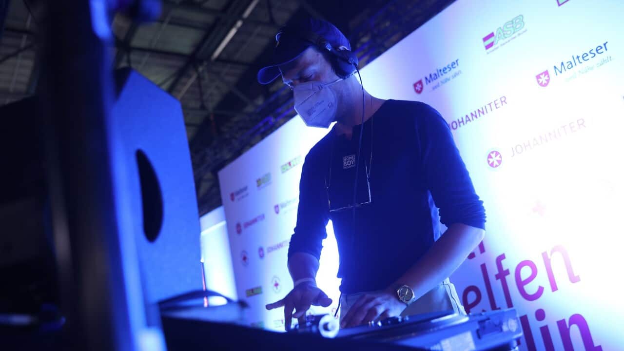 A DJ performs at the Long Night of Vaccinations in Berlin