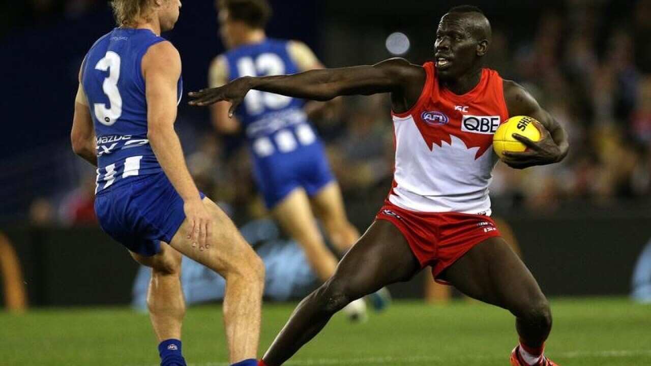 Sydney Swans defender Aliir Aliir (R)