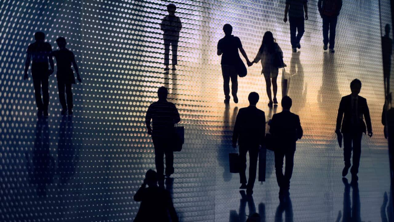 Silhouette of people walking