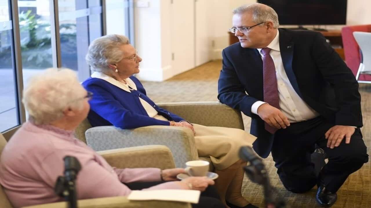 Australian Prime Minister Scott Morrison speaks to elderly residents.