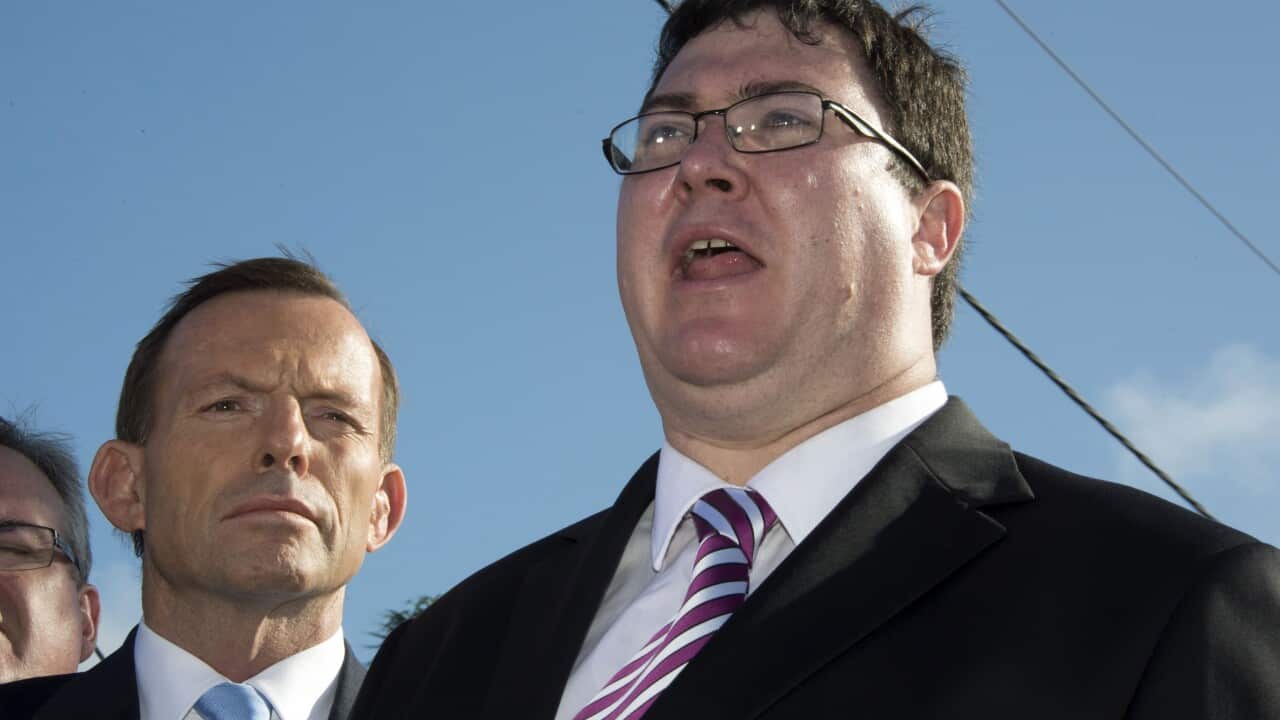 Member for Dawson George Christensen speaks to the media as Opposition leader Tony Abbott announces the Bruce Highway upgrade funding in Mackay, Wednesday, July 17, 2013. (AAP Image/Daryl Wright) NO ARCHIVING