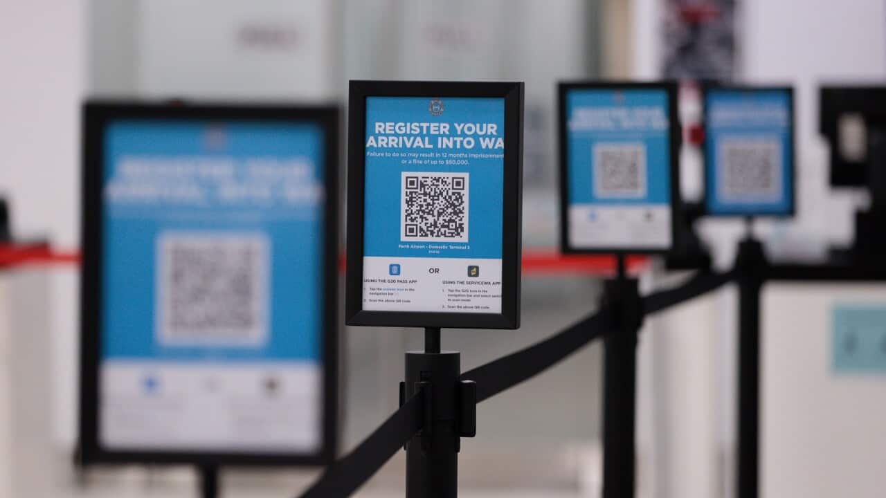 G2G Pass QR code signs to register arrivals are seen inside Perth Domestic Airport in Perth, Saturday, February 5, 2021. (AAP Image/Richard Wainwright) NO ARCHIVING