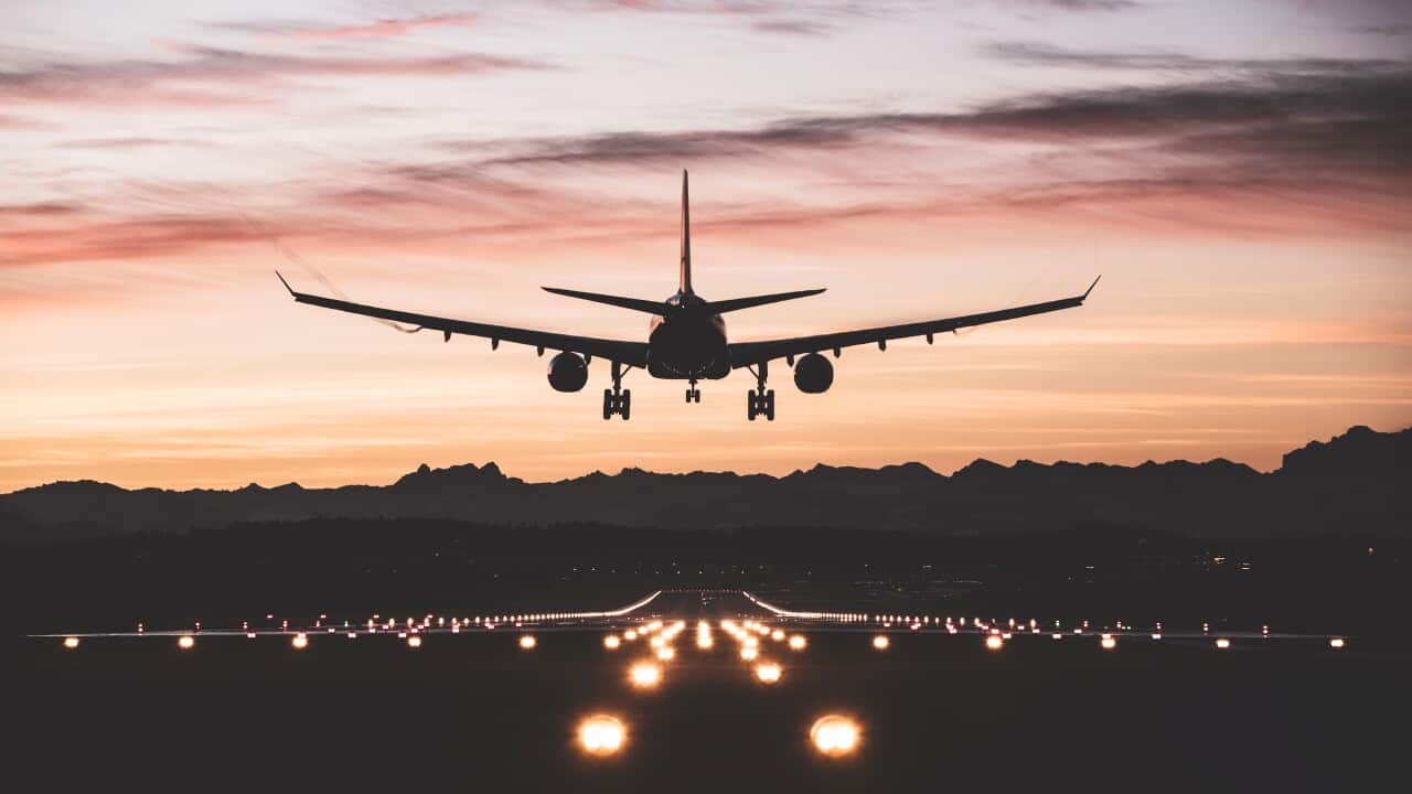 Aircraft landing at sunrise