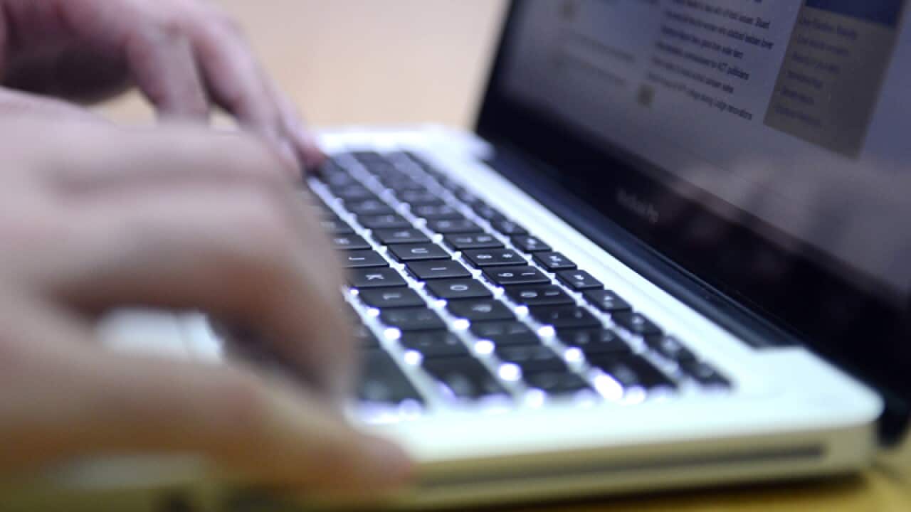 A person uses a laptop computer