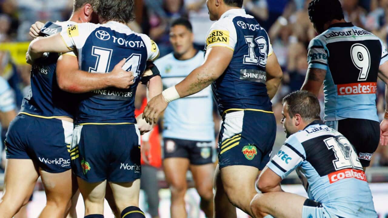 Cowboys Scott Bolton is congratulated by team mates after he scored