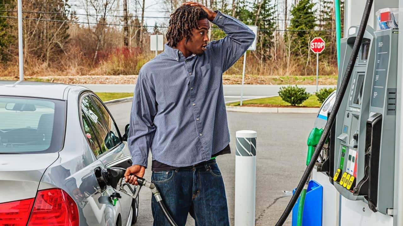 Young Man at Gas Station in Shock Over Sale Price