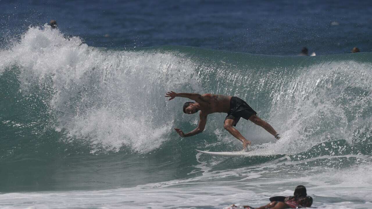 A surfer on the Gold Coast (AAP).jpg