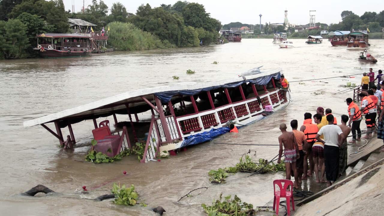 Thai rescues search victim boat capsized at Chao Phraya River in Ayuthaya Province, Thailand, Sunday, Sept. 18, 2016. 