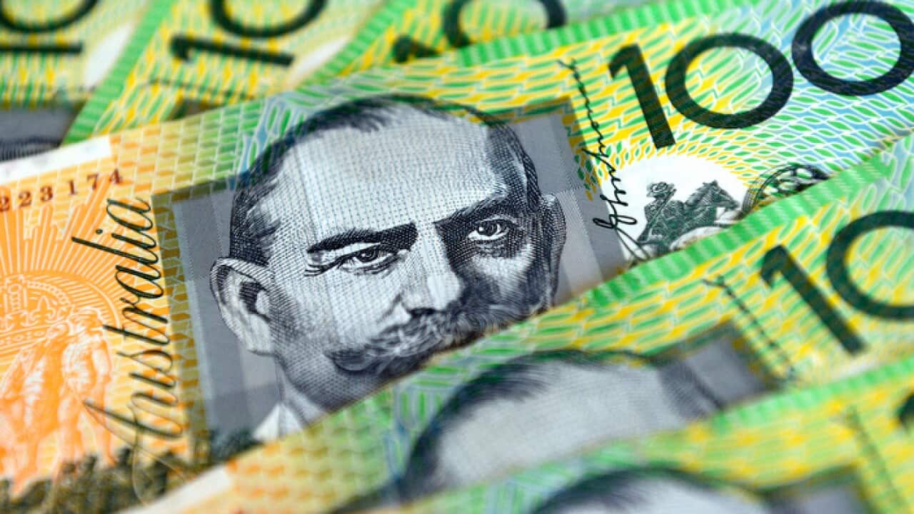 $100 Australian dollar notes, pictured in Brisbane, Tuesday, Aug. 20, 2013. (AAP Image/Dan Peled) NO ARCHIVING