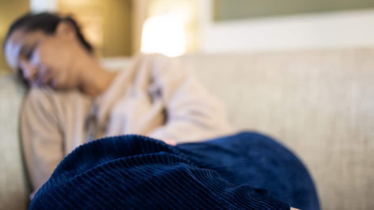 black woman napping on sofa