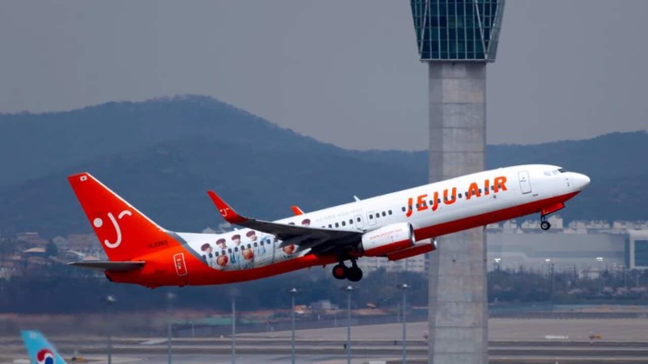 A Jeju air flight takes off.