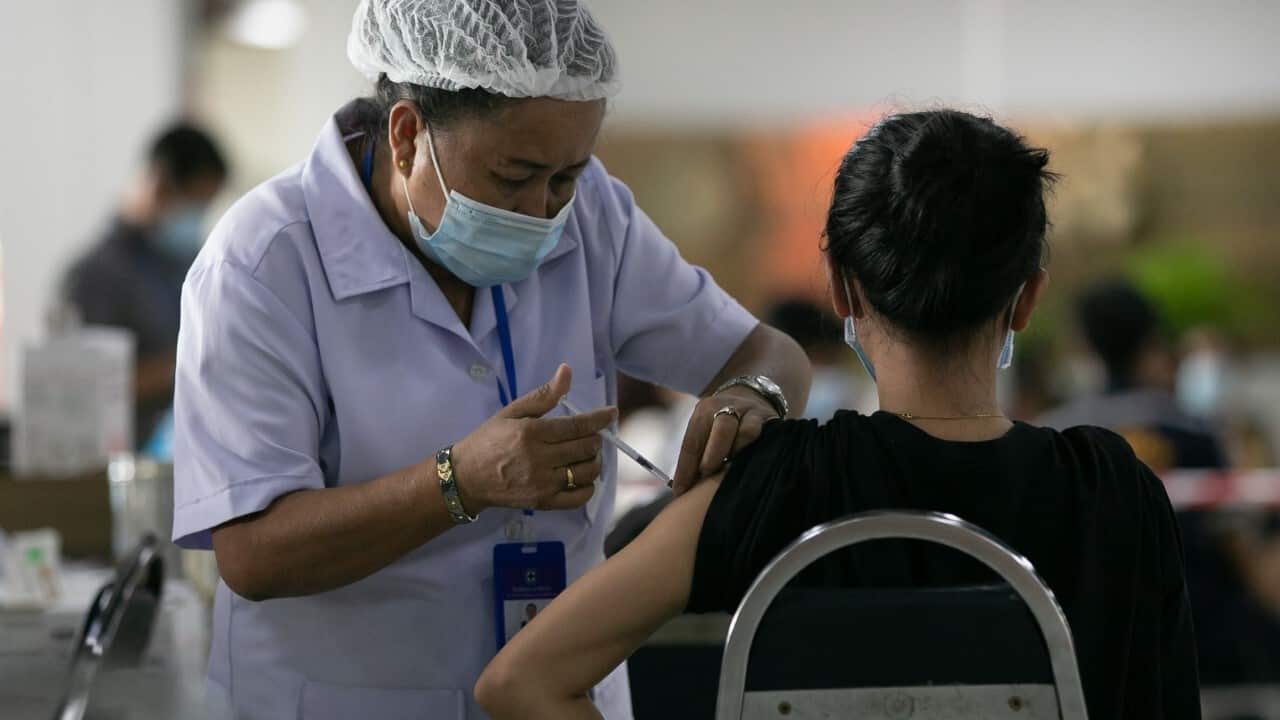 A Lao woman receives a dose of COVID-19 vaccine at a vaccination centre in Vientiane, Laos, June 17, 2021 (Kaikeo Saiyasane - Xinhua via Getty Images)