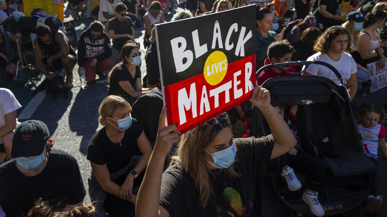 Protesters participate in a Black Lives Matter rally in Brisbane.