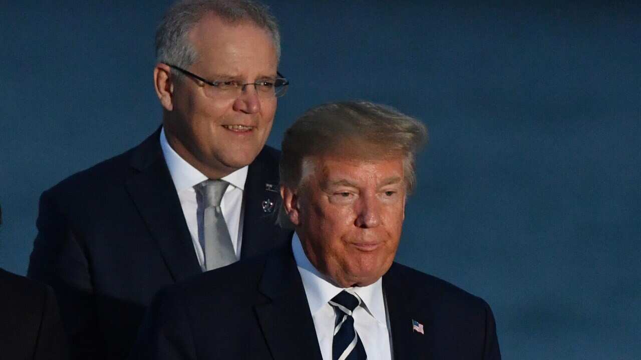 U.S. President Donald Trump and Australia's Prime Minister Scott Morrison at the family photograph during the G7 Summit in the town of Biarritz, 800km south of Paris in France, Sunday, August 25, 2019.  (AAP Image/Mick Tsikas) NO ARCHIVING