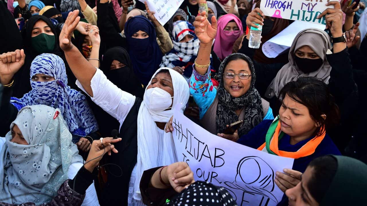 Muslim women hold placards during a protest in Allahabad after schools in Karnataka denied entry to students for wearing hijabs.