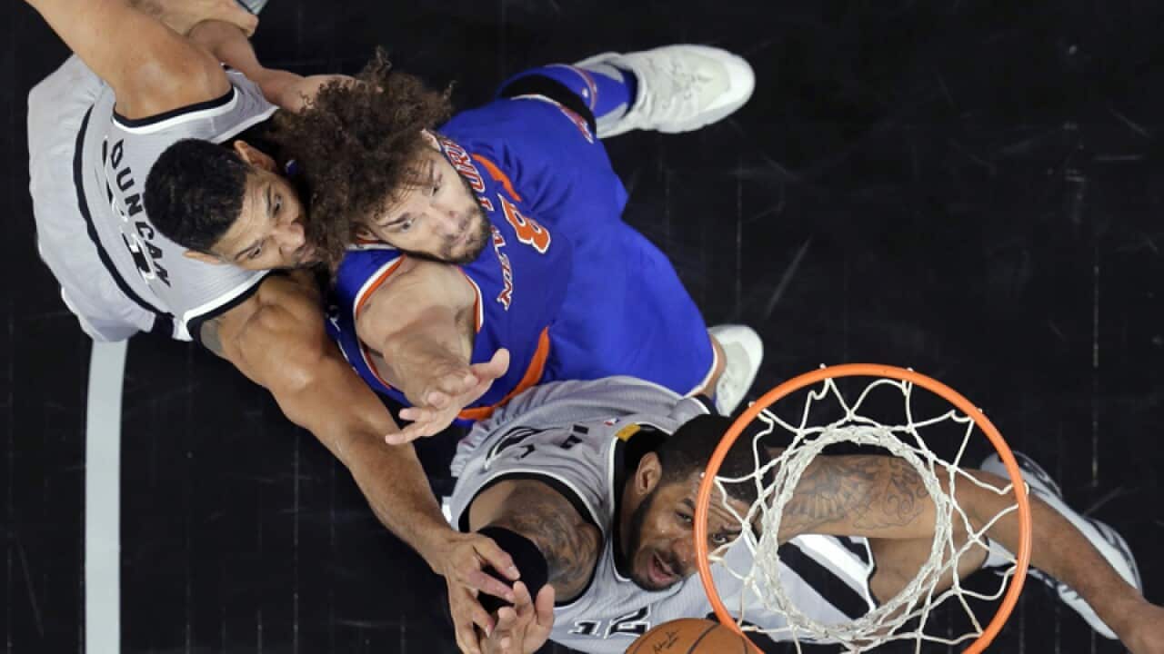 Knicks center Robin Lopez, Spurs' Tim Duncan and LaMarcus Aldridge