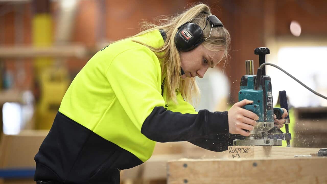 Paige Hunter is seen at work during a workshop tour at Eric Jones Stairbuilding in Blackburn,