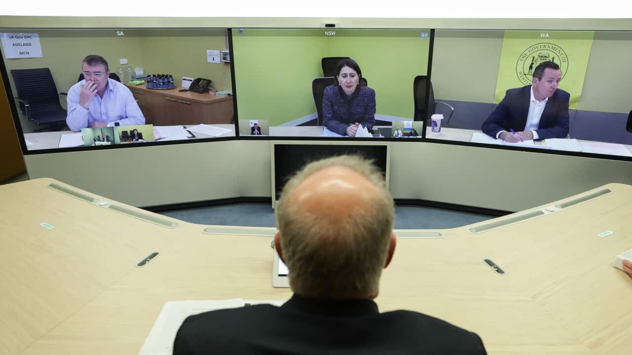 Prime Minister Scott Morrison speaks with (on screen) Jim McDowell, Chief Executive of the South Australia Department of Premier and Cabinet, Premier of NSW Gladys Berejiklian and Premier of Western Australia Mark McGowan during a National Cabinet meeting