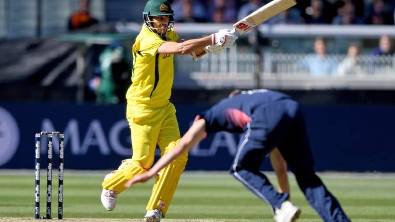 Pat Cummins of Australia strikes the ball
