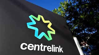 A sign for Centrelink in a bush