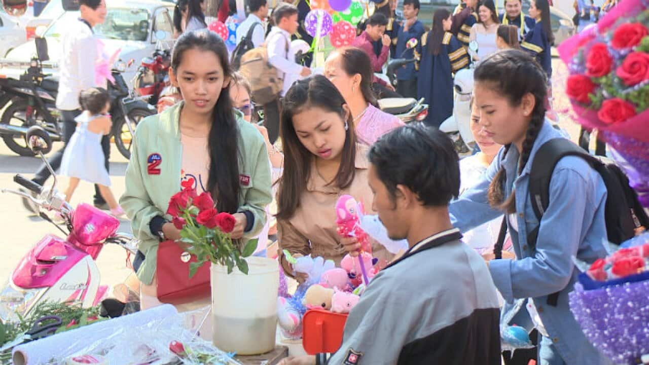 Teenagers are buying flowers on Valentine's day in Cambodia