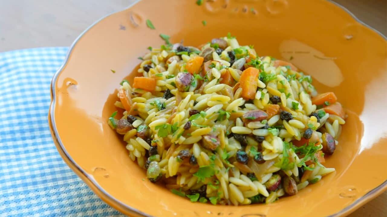 Toasted orzo with carrots, raisins and pine nuts,